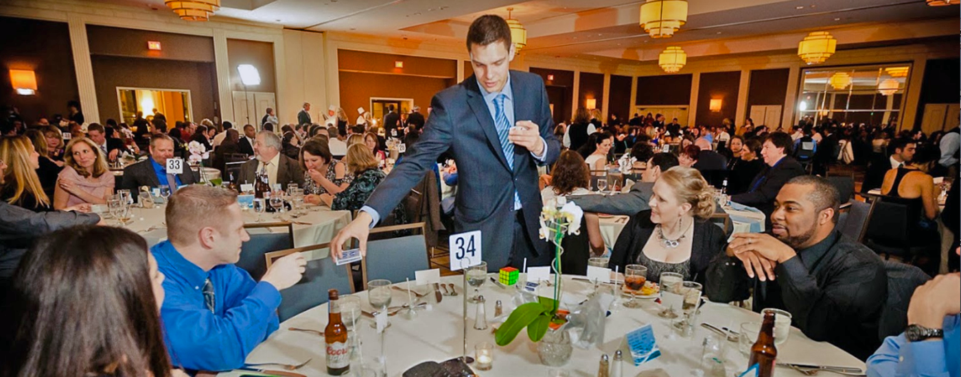 Magician Steven Brundage performing magic at a corporate event