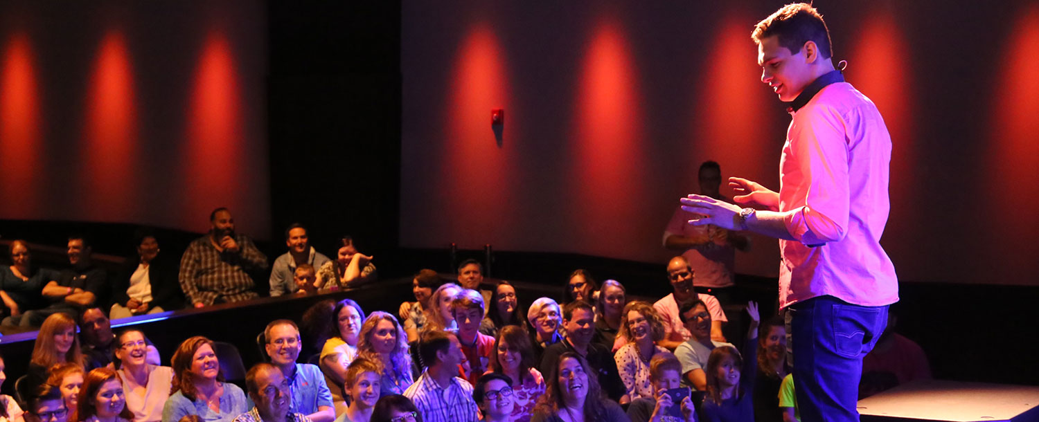 Magician Steven Brundage performing for a crowd