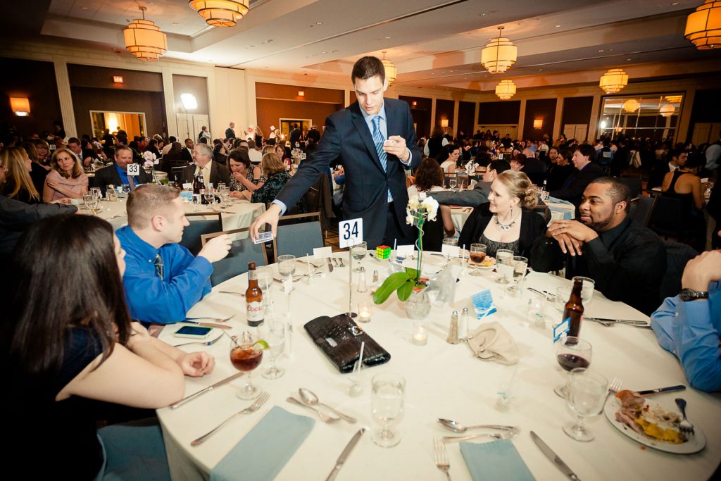 Magician Steven Brundage performing up-close magic at a corporate event