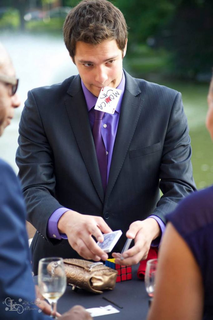 Magician Steven Brundage performing a card trick